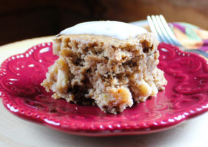 a piece of vegan apple walnut spice cake