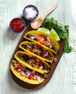 a tray of vegan black bean and tempeh tacos